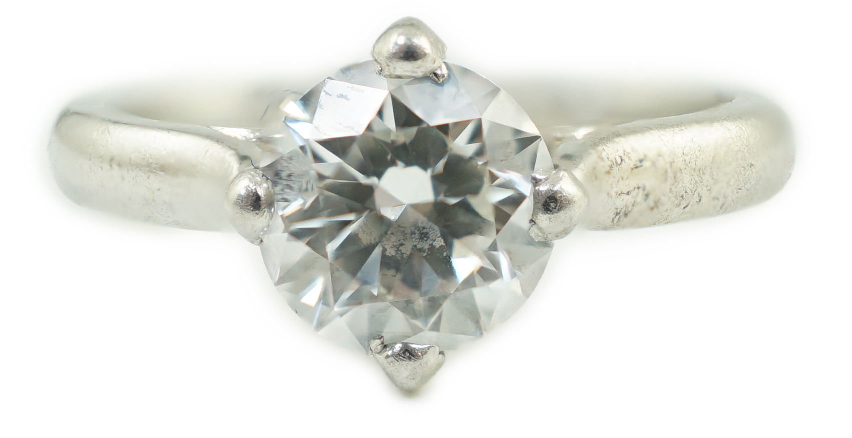 A modern platinum and solitaire diamond set ring